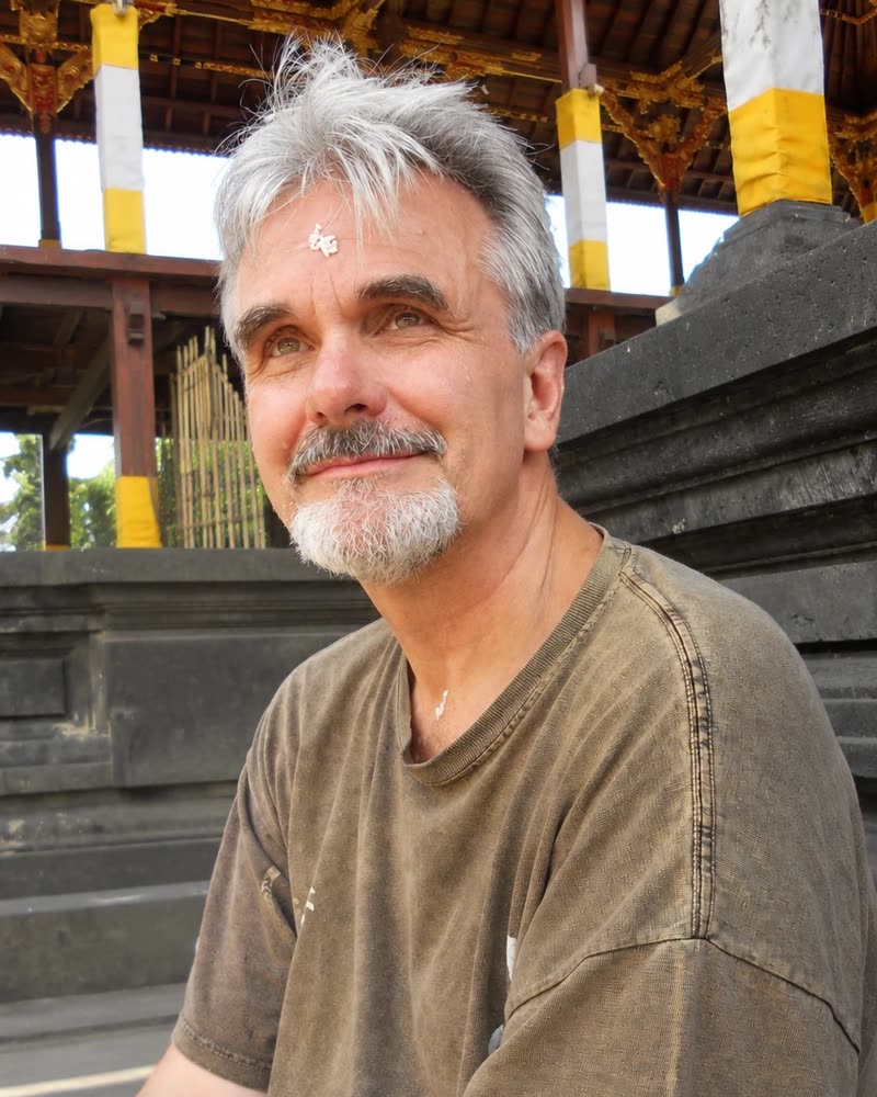 Kristopher Raphael sitting on temple steps